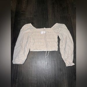American eagle cream blue and peach long sleeve drop top. Size small.